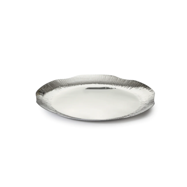 The Hammering Stainless Steel Dinner Plate is designed to offer a transitional experience while it inculcates the charm of a handcrafted texture. The texture is made through the technique of hammering and finished with a high gloss mirror polish. The Plate Hammering Range refers to a collection of plates, often made from metal such as copper or stainless steel, that have been hammered to create unique textures and patterns on their surfaces. These plates are typically used for serving food and can add a touch of artisanal craftsmanship to your dining experience. The hammering process gives these plates a distinct visual appeal and can make them an attractive choice for special occasions or as decorative elements in your dining setup. The Plate Hammering Range may include various plate sizes and designs to suit different serving needs and preferences. These plates are a popular choice for those who appreciate handcrafted and visually striking tableware.