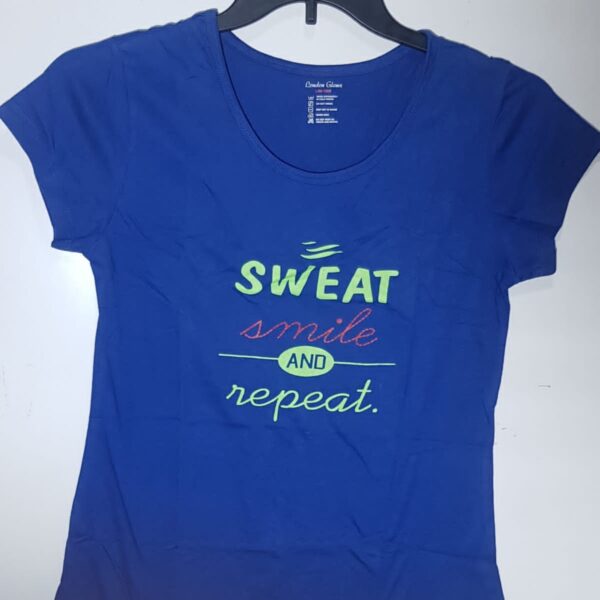 Color: Dark Blue Design: The T-shirt features the phrase "SWEAT SMILE," which could be in a bold font or accompanied by graphics or illustrations related to fitness or a positive, active lifestyle. Sleeves: The sleeves can vary from short sleeves to long sleeves, depending on your preference and the season. Neckline: Choose a neckline that suits your style, such as a crewneck, V-neck, or scoop neck. Fit: Opt for a comfortable fit, whether it's a relaxed fit, a slightly fitted style, or an oversized look. Fabric: Choose a soft and breathable fabric like cotton or a cotton blend for comfort during workouts or casual wear.