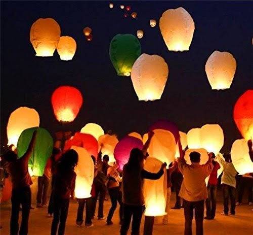 A multicolored sky lantern is a decorative and festive item designed for outdoor use. Typically made of lightweight, flame-resistant materials such as paper and wire, the lantern is crafted in a way that allows it to be inflated and then released into the sky. Once lit, the lantern's flame heats the air inside, causing it to rise and lift the lantern into the air. The multicolored aspect suggests that the lantern is adorned with various vibrant hues, adding to its visual appeal during both daytime and nighttime events. These lanterns are often used in celebrations, ceremonies, and special occasions, creating a captivating and magical display as they ascend into the night sky.