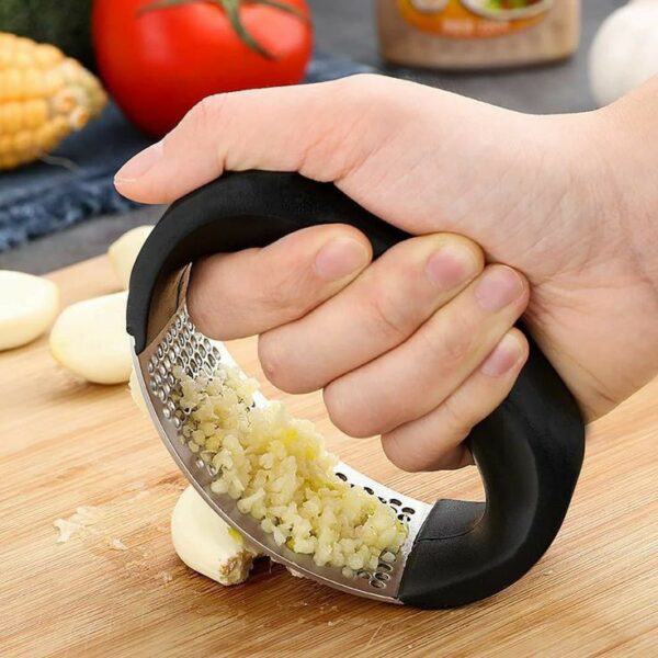 A Stainless Steel Garlic Press is a kitchen tool designed for crushing garlic cloves effectively