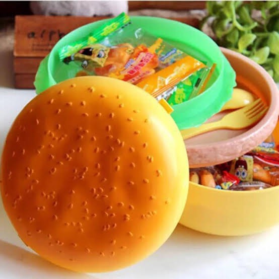 The Burger Lunch Box is a lunch container designed in the shape and style of a burger. Typically made of plastic, it features compartments for storing different food items, resembling the layers of a burger. This novelty lunch box is both functional and visually appealing, providing a playful and creative way to carry and organize meals. The design makes it a popular choice for kids and individuals looking for a unique and fun lunch storage solution.