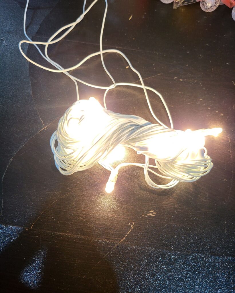 a decorative lighting product with warm white LED lights attached to a wire. It's often used for creating a cozy and enchanting ambiance in various settings. The wire allows for flexible and creative placement of the lights, making it suitable for decorating both indoor and outdoor spaces.