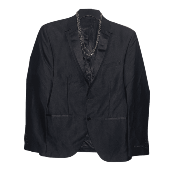 Presenting a sophisticated Solid Single Breasted Men's Blazer, perfect for party occasions. This exquisite blazer comes in a classic Plain Black design, adding a touch of elegance to your ensemble. Crafted with precision and attention to detail, it exudes a timeless charm. The single-breasted style enhances its suave appeal, making it an ideal choice for various celebratory events. Elevate your fashion quotient with this sleek and versatile black blazer, tailored for a polished look that seamlessly blends style and comfort