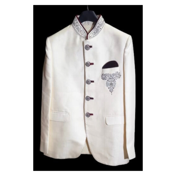 A Cream Ethnic Blazer for Men is a sophisticated and culturally inspired outerwear garment designed to complement traditional Indian attire. This blazer combines contemporary style with ethnic elements, making it suitable for a variety of formal occasions, ceremonies, and festive events. The blazer is crafted in a cream-colored fabric, offering a versatile and neutral base that can be paired elegantly with various traditional Indian ensembles.