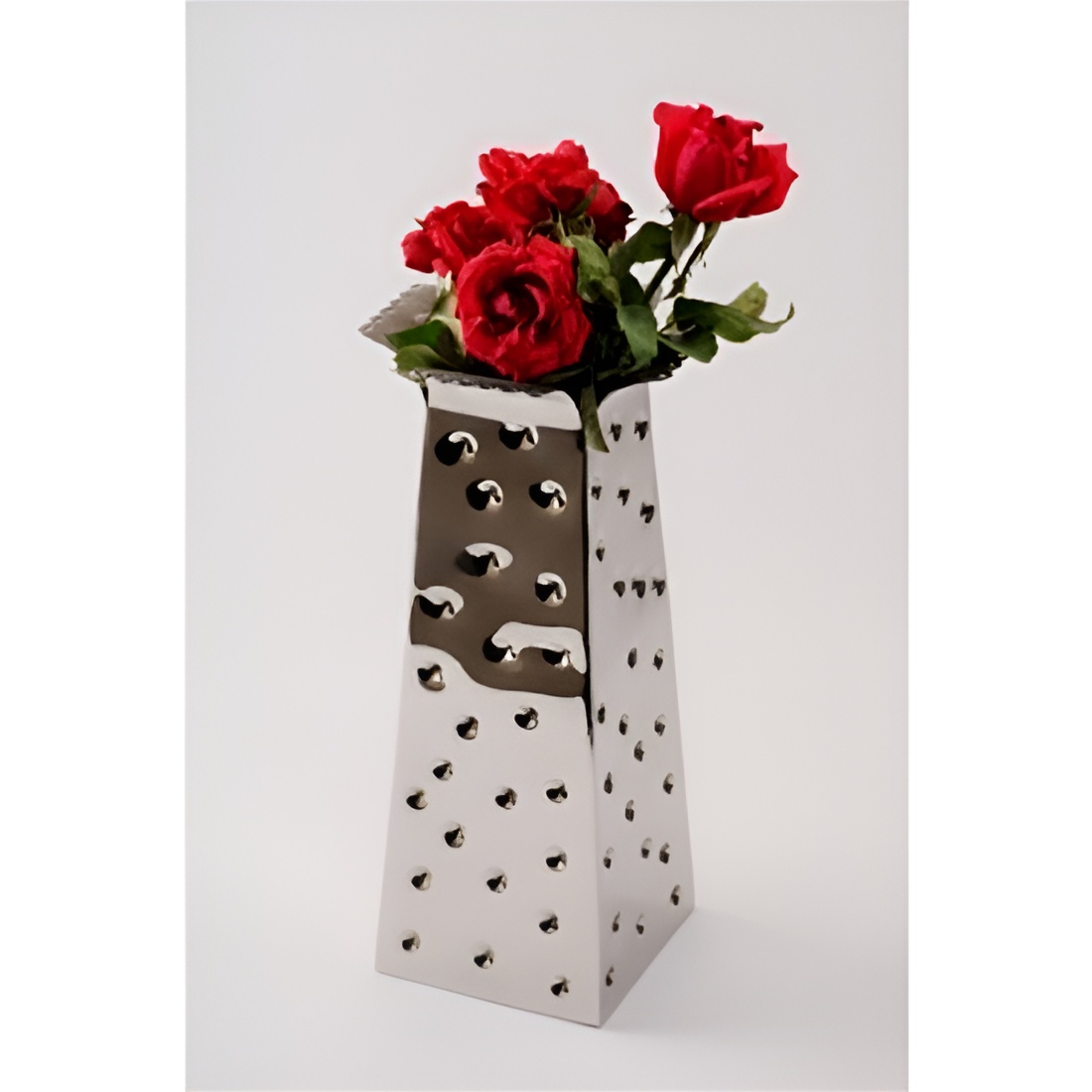 A Dimple Flower Vase is a unique and aesthetically pleasing vase designed to display flowers and enhance the beauty of floral arrangements. As the name suggests, it typically features a distinctive dimpled or textured surface that adds a touch of elegance and style to the vase.
