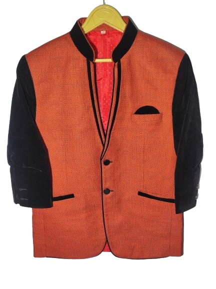 "This men's blazer features a striking combination of vibrant orange and classic black, creating a bold and stylish ensemble. Crafted from high-quality fabric, the blazer exudes sophistication and modernity. The orange hue adds a contemporary touch, while the black accents provide a timeless and versatile appeal.