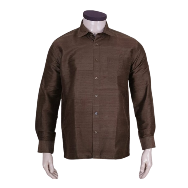 A boys' long sleeve dress shirt in brown is a traditional and formal clothing item designed for young boys. This shirt features long sleeves, providing a more sophisticated and polished look. The brown color adds a touch of warmth and versatility to the garment. It is well-suited for various formal occasions, such as weddings, parties, or other events where a smart and well-dressed appearance is desired. The shirt is crafted with attention to detail, ensuring a comfortable fit while maintaining a stylish and refined aesthetic. The brown hue complements a range of outfits and can be paired with different bottoms to create a complete and coordinated look for young boys in Indian fashion.
