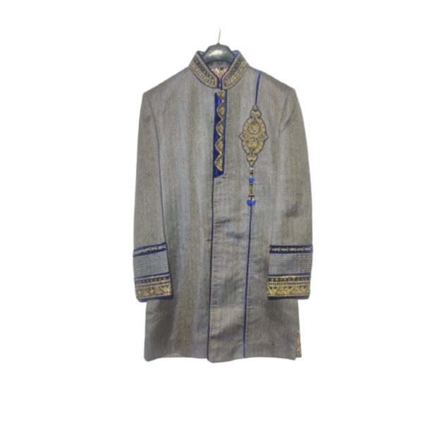 Adorned with intricate embroidery and embellishments, this Sherwani showcases a regal design that exudes sophistication. The rich fabric drapes gracefully, enhancing your stature and creating a striking silhouette. The color palette is carefully chosen to radiate opulence, with a harmonious blend of deep hues that resonate with cultural finesse.